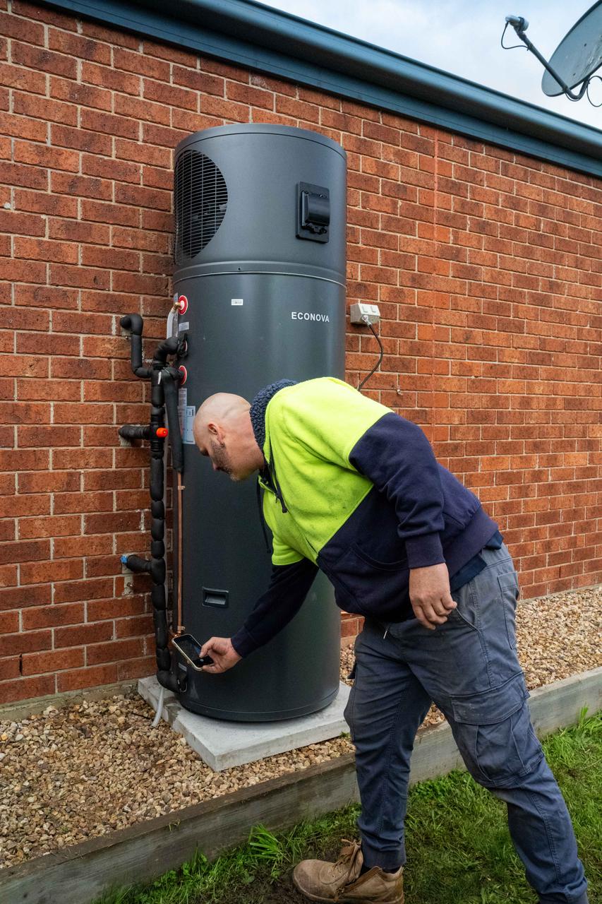 Goldsure installer at a heat pump hot water install