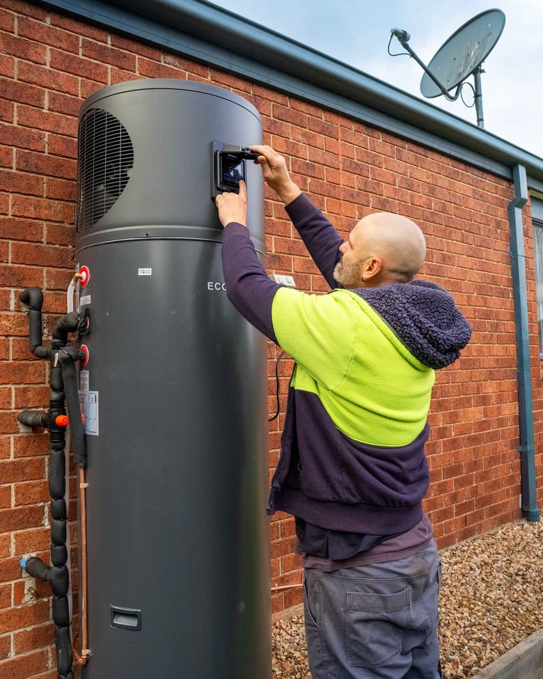 Goldsure crew installing a heat pump hot water system at a Melbourne home